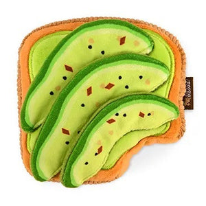 Introduce your pup to the BARKING BRUNCH - AVO-DOGGO TOAST by PLAY PET LIFESTYLES/BRANDS—a durable dog toy shaped like a slice of toast, topped with three avocado slices and decorated with embroidered seeds and seasoning. Perfect for playful pups who love dog brunch toys, it’s also machine washable for easy cleaning.