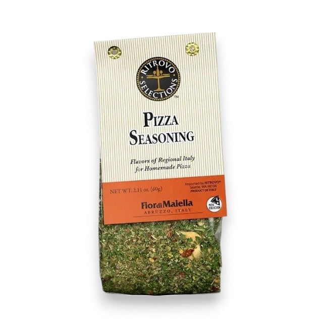 A package of RITROVO SELECTIONS - Fior di Maiella Pizza Seasoning by RITROVO, an aromatic Italian herb blend made in Italy, featuring a clear window that reveals green and red dried herbs. The label highlights authentic regional Italian flavors for homemade pizza.