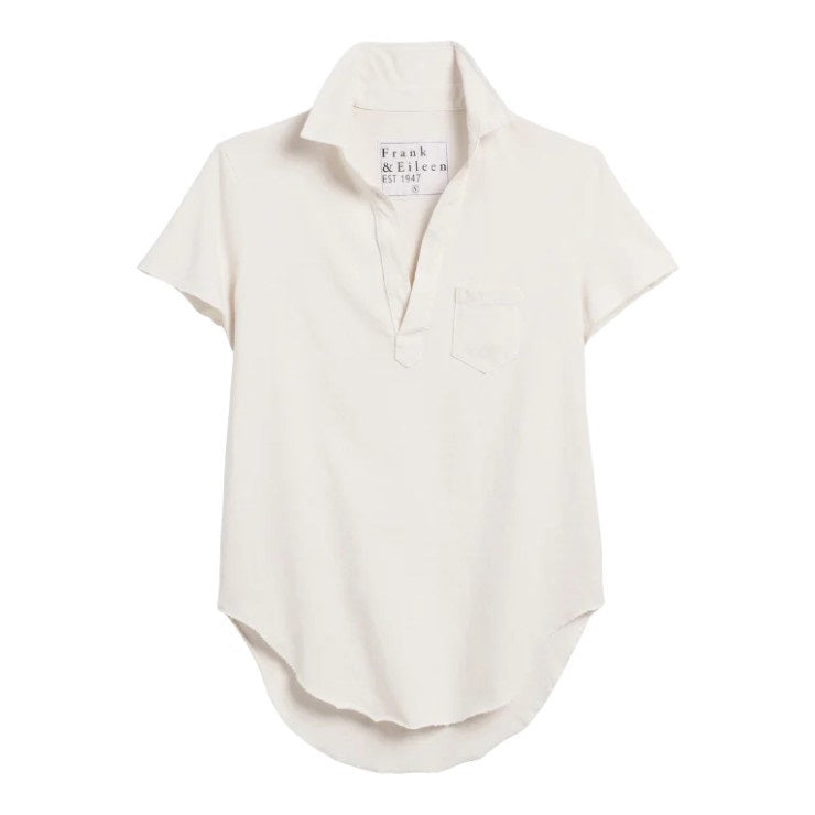 The FRANK & EILEEN Charlotte Perfect Polo Tee is a contemporary, short-sleeve polo shirt in off-white, featuring a collared neckline, an open V-neck, and a chest pocket. Displayed against a white background, the front pocket and inner label reading “Frank & Eileen EST 1947” highlight its distinctive design.