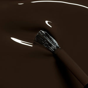 A bottle of MANUCURIST INC GREEN™ Nail Polish in the shade MOCHA, featuring a dark brown color, a black cap, and a white label that reads “QUICK DRY INTENSE COLOR.”.