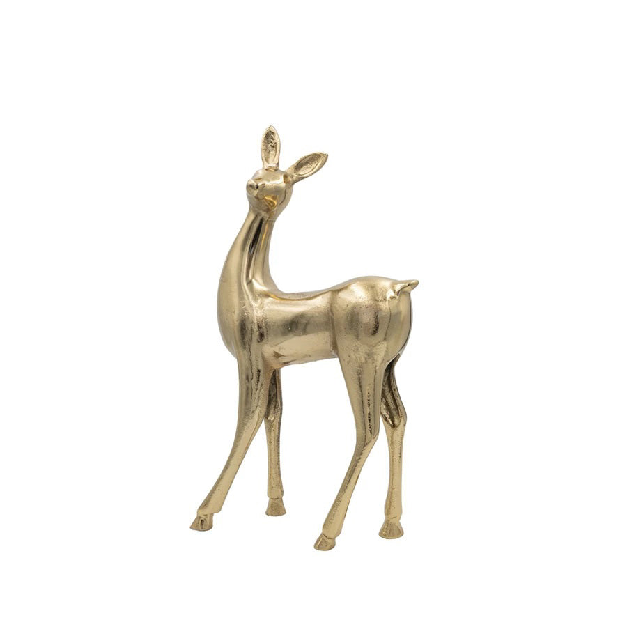 The CREATIVE COOP CAST ALUMINUM DEER GOLD FINISH - LARGE is a standing decorative deer statue with upright ears and a slender body, finished in gold and displayed against a plain white background.
