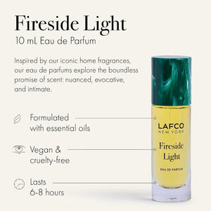 A yellow bottle of LAFCO - FINE FRAGRANCE, FIRESIDE LIGHT 10ML stands upright on a white background, featuring a marble-patterned green cap and reflecting the ambered vanilla notes of this vegan perfume.
