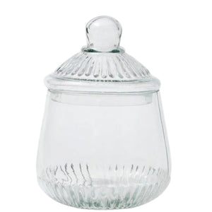 ETUHOME Bistro Glass Biscuit Jars with lids sit on a wooden tray, filled with snacks and orange-wrapped candies. The classic jar design by ETUHOME stands out against the softly blurred background.
