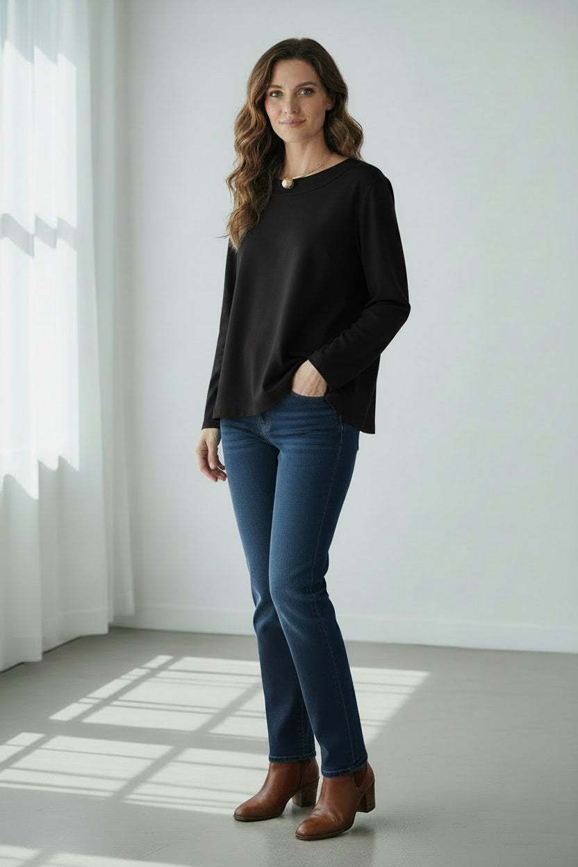 A woman with straight dark hair wears the MEIMEIJ Long Sleeve Ponte Swing Top in teal and a gold pendant necklace, standing against a plain light background, facing forward with a neutral expression.