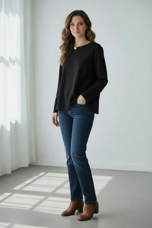 A woman with straight dark hair wears the MEIMEIJ Long Sleeve Ponte Swing Top in teal and a gold pendant necklace, standing against a plain light background, facing forward with a neutral expression.