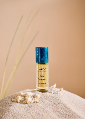 A clear glass perfume bottle labeled “LAFCO - FINE FRAGRANCE, BARE SUMMER 10ML” from LAFCO, topped with a turquoise marbled cap, this essential oil fragrance features an elegant blend that’s both refreshing and modern.