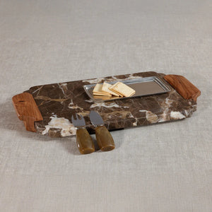 The ZODAX MOCHA MARBLE TRAY / CHARCUTERIE BOARD features a rectangular design crafted from mocha marble with striking brown and white veining, complemented by acacia wood handles on each end—ideal for serving charcuterie, shown isolated on a white background.