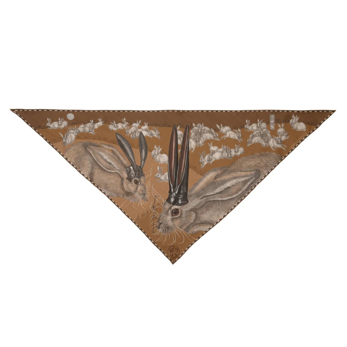 A person dressed in a light beige outfit faces away from the camera, showcasing the SABINA SAVAGE ENGLAND - THE FLOATING RABBITS TRIANGLE SILK TWILL SCARF, a 100% silk twill accessory adorned with whimsical black-tailed jackrabbits wearing top hats. The backdrop is a plain light gray.