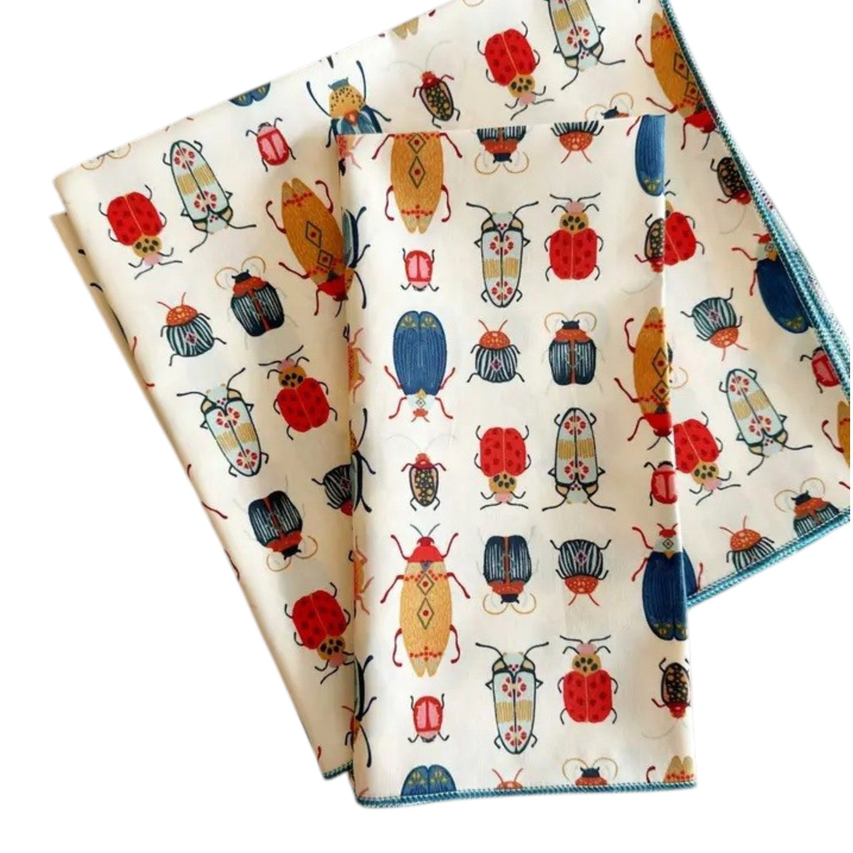 Introducing the DOT AND ARMY - BEETLE DINNER NAPKIN by DOT AND ARMY: a folded white cotton napkin adorned with a vibrant pattern of beetles and bugs in red, blue, yellow, and black hues, finished with blue edge stitching. Perfect as reusable napkins or charming beetle dinner accents for your table setting.