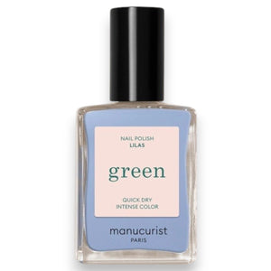 A white nail polish brush spreads MANUCURIST - GREEN™ NAIL POLISH IN LILAS by MANUCURIST INC, a pale lavender vegan formula, smoothly across the surface to create a glossy, even layer.