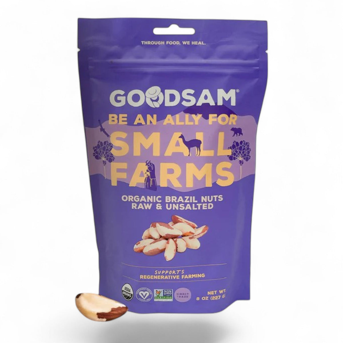 A purple GOODSAM FOODS bag labeled &quot;GOODSAM-ORGANIC BRAZIL NUTS, RAW &amp; UNSALTED&quot; contains raw, unsalted organic Brazil nuts rich in selenium. The Amazon-sourced nuts are from small farms using regenerative practices; one nut is shown in front.