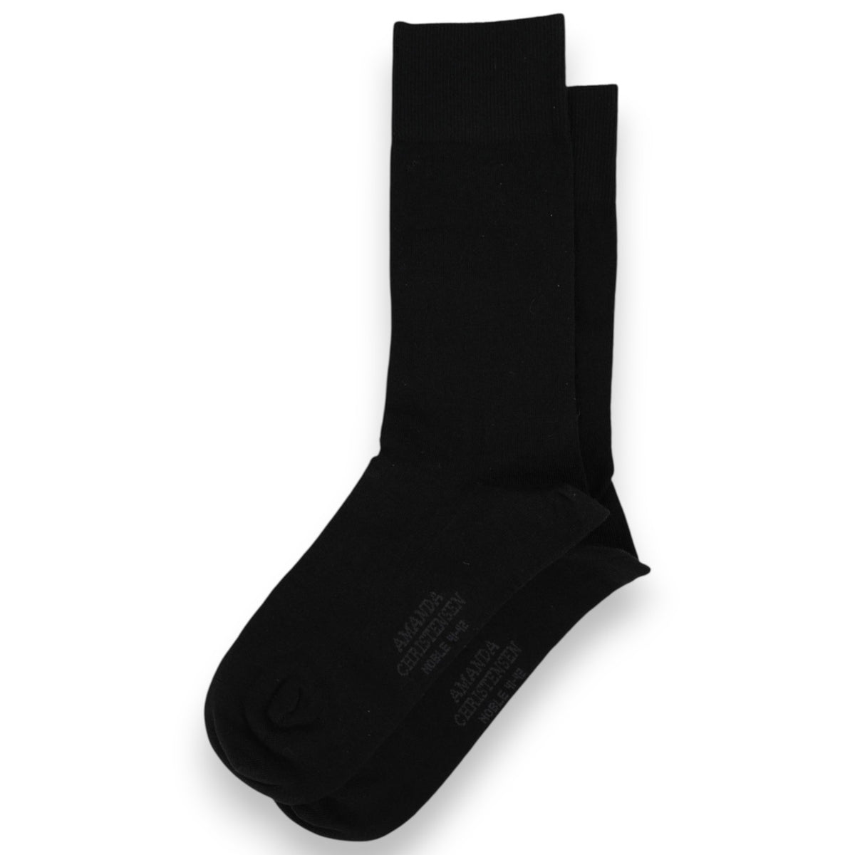 A pair of AMANDA CHRISTENSEN - Noble Cotton &amp; Cashmere Blend Mid-Calf Socks in black, elegantly arranged with one sock neatly stacked atop the other on a white background—an ideal choice for those seeking luxury men’s socks that embody understated elegance.