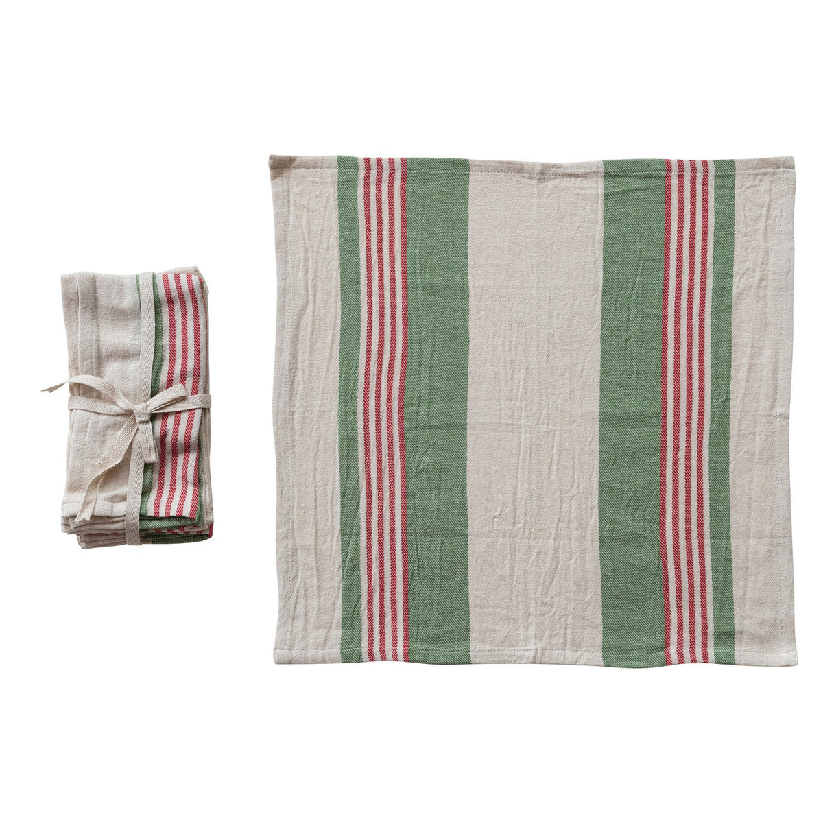 A folded stack of CREATIVE COOP FLOUR SACK NAPKIN IN RED AND GREEN STRIPE sits beside an unfolded towel, both featuring wide green and beige stripes with narrow red on white for a charming kitchen accent.