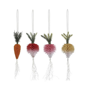 The CREATIVE COOP FLOCKED BOTTLE BRUSH VEGETABLE ornaments, featuring green tops and white roots in assorted carrot and radish styles, hang decoratively on a light beige wall.