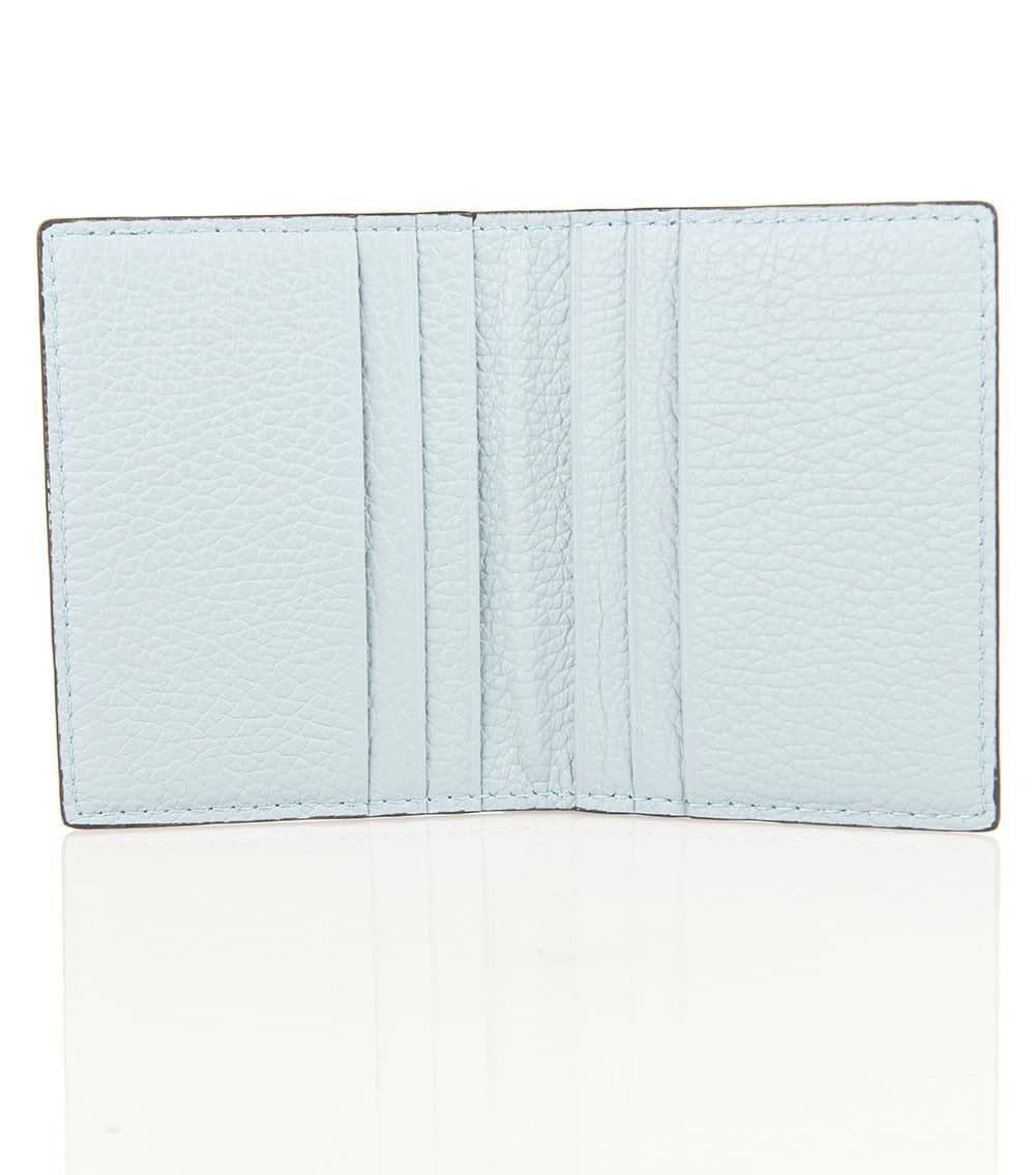 The open gray LEATHER CARD HOLDER by LE BORSETTE features multiple slots. &quot;Genuine Leather Made in Italy&quot; is engraved in the bottom right corner, with its shiny surface reflecting sophistication and fine Italian craftsmanship.