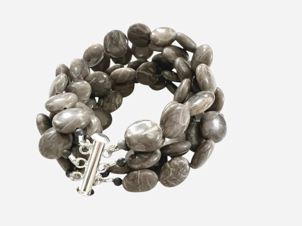 The ANN LIGHTFOOT Brown Jasper Coin Five Strand Bracelet features chunky, polished brown jasper stones and a stainless steel clasp, shown on a plain white background.