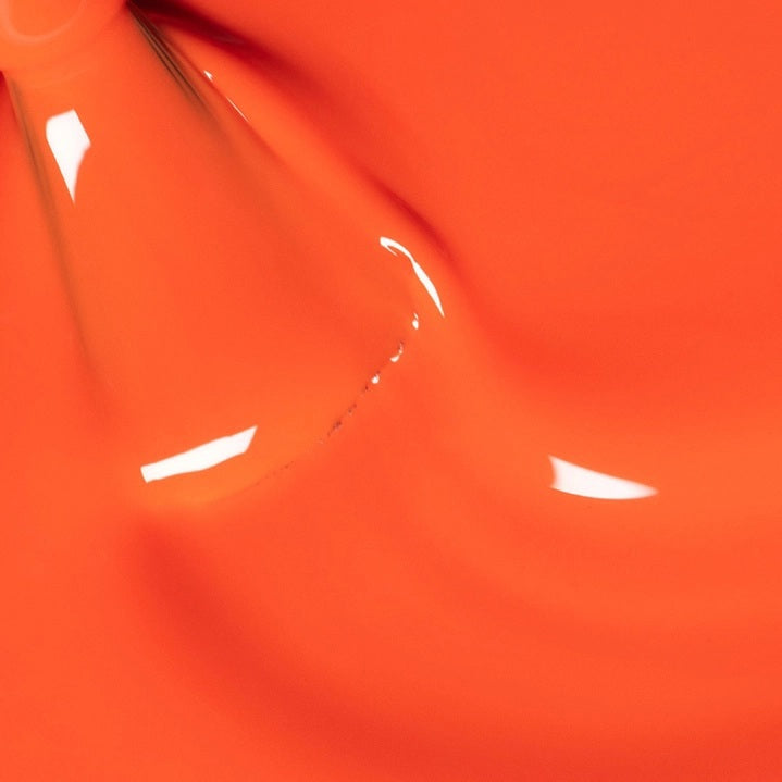 The MANUCURIST - GREEN™ Nail Polish in Sunset by MANUCURIST INC features a vibrant orange hue, packaged with a black cap and a label that says “green, quick dry intense color.” This vegan, non-toxic, and eco-friendly nail polish delivers bold color for your nails.