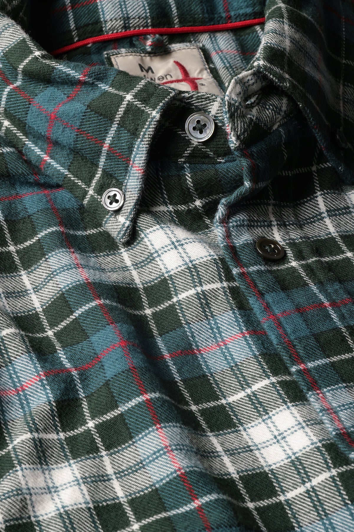 The RELWEN Flyweight Flannel Shirt in Forest Green Plaid is laid flat on a white background. Crafted from lightweight flannel, this soft long-sleeve button-up offers both comfort and style for everyday wear.