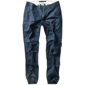 RELWEN - Flyweight Flex Chino in Dark Navy: A lightweight pair of chinos with two back pockets, button closures, and visible stitching, shown laid flat on a white background.