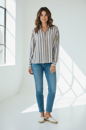 The SEVENTY VENEZIA Stripe Blouse by SEVENTY is an Italian-made viscose shirt with long sleeves, a classic collar, and vertical stripes in white, beige, brown, and gray. Its slightly loose fit provides effortless style.