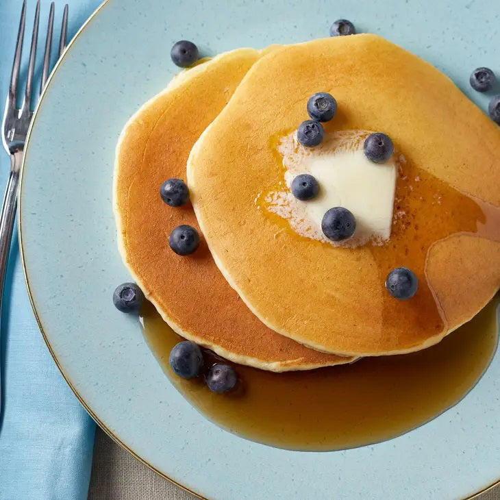 A yellow resealable 907g (32oz) pouch of CUP4CUP Gluten Free Pancake &amp; Waffle Mix features white and blue text, "Gluten Free" label, and is ideal for making pancakes or gluten-free waffles.
