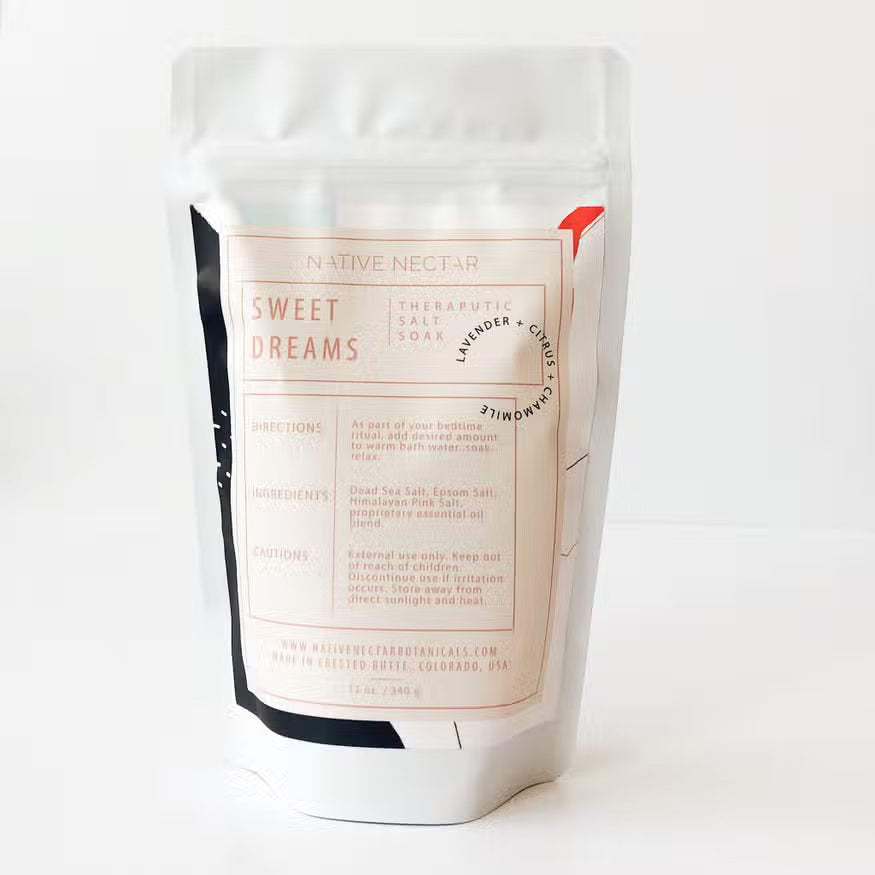 A white stand-up pouch labeled "Native Nectar Sweet Dreams Salt Soak." The product description states it includes lavender and chamomile, with soothing Epsom salt and lavender essential oil for muscle relaxation. Directions, ingredients, cautions, website, and origin information are also listed.