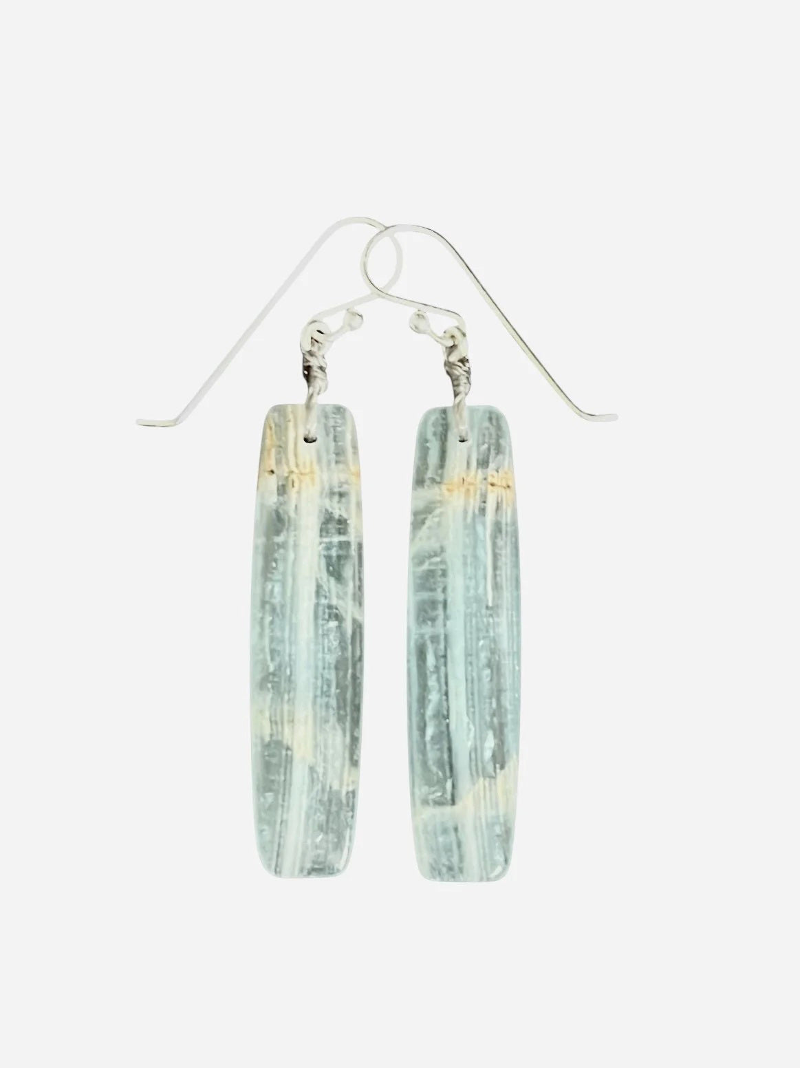 The ANN LIGHTFOOT - BLUE CALCITE SLAB EARRINGS feature long, rectangular, translucent blue-green calcite stones with natural streaks, suspended from sterling silver earwires against a plain white background.
