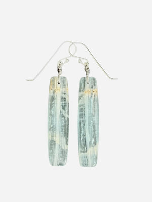 The ANN LIGHTFOOT - BLUE CALCITE SLAB EARRINGS feature long, rectangular, translucent blue-green calcite stones with natural streaks, suspended from sterling silver earwires against a plain white background.