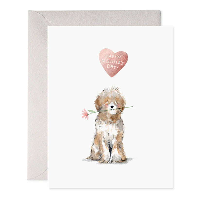 The E. FRANCES PAPER DOG MOM MOTHERS DAY CARD showcases a fluffy dog with a pink flower, beneath "Happy Mother's Day!" in stylish pink on luxurious paper. It includes a light gray envelope.