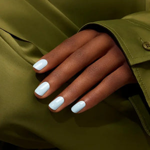 A chart featuring ten blue nail polish swatches—each labeled in English and French: Light Blue, Bubble, Lilas, Saphir, Ultramarine, Dark Night, Riviera, Dark Clover, Poppy Seed, Midnight, and Navy Blue—from MANUCURIST INC. Perfect for finding a complementary non-toxic shade or matching the GREEN™ Nail Polish in Light Blue.