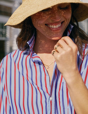 The FRANK & EILEEN EILEEN Relaxed Button Up Shirt in Superluxe Cotton Stripe features a relaxed fit, long sleeves, red/white/blue vertical stripes, front pocket, rolled-up sleeves, and a curved hem.
