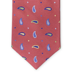 A rolled-up BIRD DOG BAY PETER-BLAIR Bespoke Paisley Soiree Silk Tie in red, featuring blue, yellow, and green paisleys and dots with a subtle diagonal ribbed texture, expertly handmade in New York.