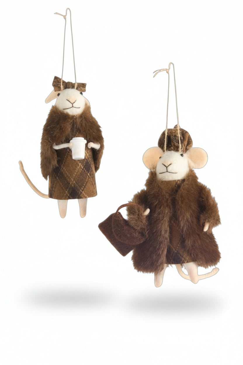 Two hanging mouse ornaments in assorted styles: one wearing a plaid coat and holding a white cup, and the other, a FUR COAT MOUSE ORNAMENT, wearing a hat and carrying a small handbag.