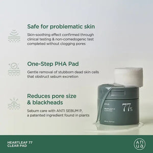 A green cylindrical container with a lid, labeled "ANUA HEARTLEAF 77% CLEAR PAD" in white text is featured. From KOSMIC KBEAUTY SKINCARE, it contains 160ml of heartleaf extract, renowned for anti-inflammatory benefits and minimizing pore size. Set against a plain white background.