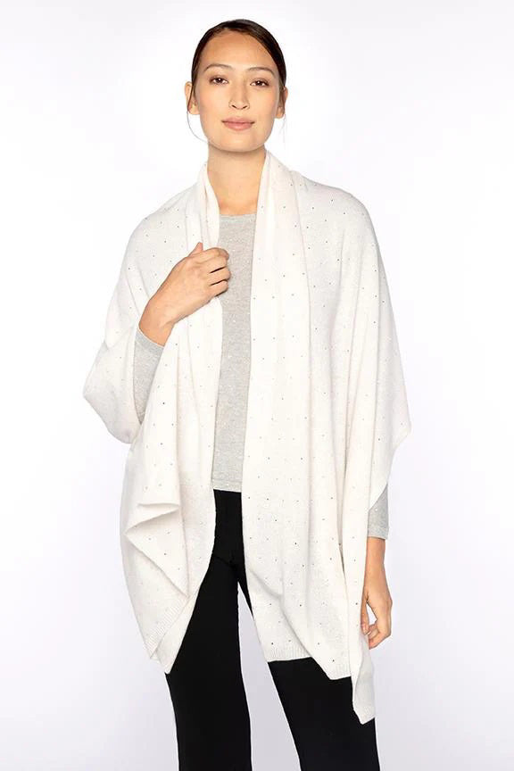The KINROSS CASHMERE - FWT CRYSTAL WRAP by KINROSS is a plain black cashmere scarf, draped in a loose loop with even ends, showcasing its soft, warm texture against a white background.