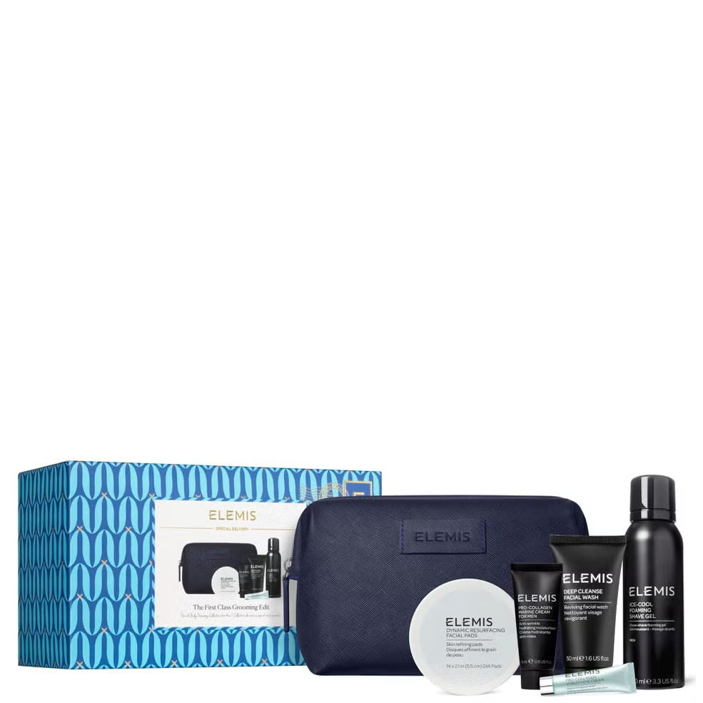 The ELEMIS - MEN'S 1ST CLASS GROOMING KIT by ELEMIS - STEINER features a dark blue travel bag behind five men's skincare products, including facial wash, Pro-Collagen Marine Cream for Men, two tubes, a small bottle, and shaving gel.