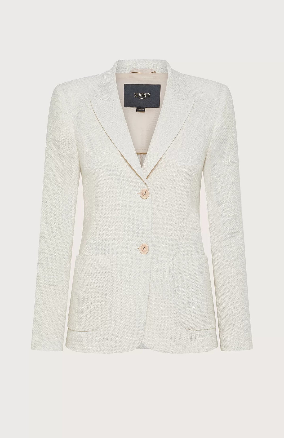 The SEVENTY VENEZIA single-breasted blazer from SEVENTY features a cream-colored fitted design with a notched lapel collar, two beige buttons at the front, and two front pockets. Made in Italy from textured lurex pique fabric, it includes a label inside the collar reading &quot;Seventy.