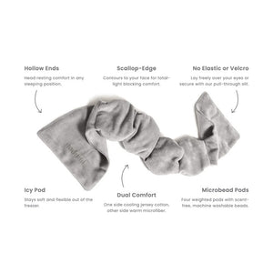 The NODPOD Weighted Sleep Eye Mask in Bone by NODPOD is a beige, segmented, plush mask with wider ends and a gently wavy, narrower middle section, shown laid flat on a white background—ideal for providing gentle pressure and soothing comfort as a weighted eye mask.
