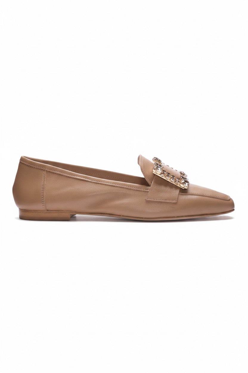 The MICHELE LOPRIORE - MARZIA LOAFER is an elegant flat crafted in Italy from tan genuine leather, featuring a low heel and a large decorative buckle embellished with sparkling crystals on the upper front.