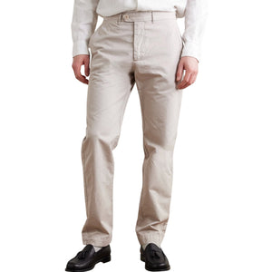 A close-up of the HARTFORD - TAYLOR PANTS IN STONE shows a buttoned back pocket, belt loop, and visible stitching on the waistband of these straight-leg men's pants.