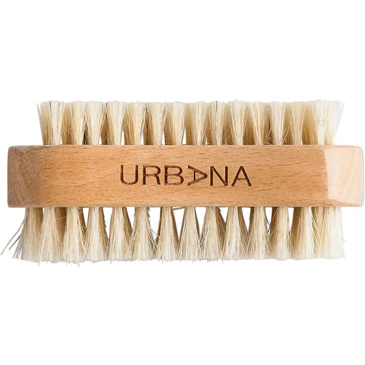 The EUROPEAN SOAPS, LLC NAIL BRUSH features a wooden handle with "URBANA" engraved on it and is equipped with light-colored bristles that are evenly trimmed and firm, ensuring effective cleaning. Perfect for personal care enthusiasts and ideal for creating a private spa experience, the brush is beautifully showcased against a white background.