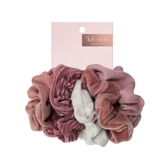 The KITSCH Velvet Scrunchies, perfect hair accessories in dusty pink and sage green, boast a soft texture. They come elegantly gathered on a white card labeled "KITSCH" with "SCRUNCHIE" below.