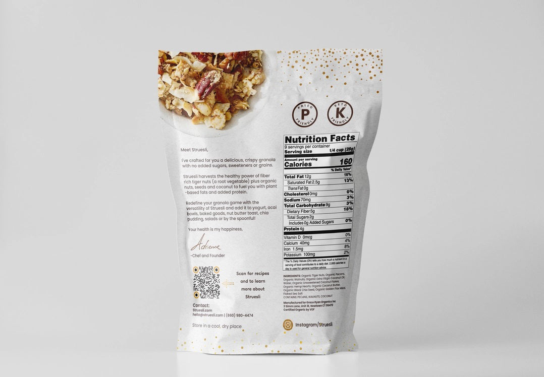 A white bag of STRUESLI - ORIGINAL ORGANIC GRANOLA is displayed against a simple backdrop. The packaging emphasizes that it contains ingredients such as tiger nuts, pecans, walnuts, coconut flakes, among others. Notable features include the absence of sweeteners and grains, along with being rich in plant-based protein for a nutritious boost.