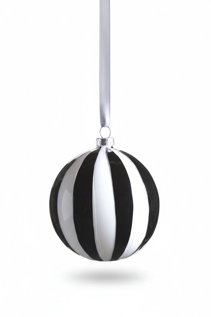 ZODAX TWILIGHT STRIPE GLASS ORNAMENT: a 4-inch diameter glass ornament featuring alternating black and white vertical stripes, hanging from a grey ribbon.
