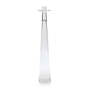 The ZODAX AMIN GLASS CANDLEHOLDER LARGE is a tall, slender clear glass candle holder with a narrow top and widening base, measuring 3.75 in x 19.75 in (9.53 cm x 50.17 cm), shown upright against a white background.