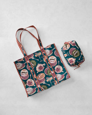 Discover a repeating pattern of caviar tins, open shells filled with caviar, mini forks, and champagne glasses set against a deep green background—an elegant design featured on the PRINTFRESH - CHAMPAGNE & CAVIAR TRAVELER TOTE by PRINTFRESH.