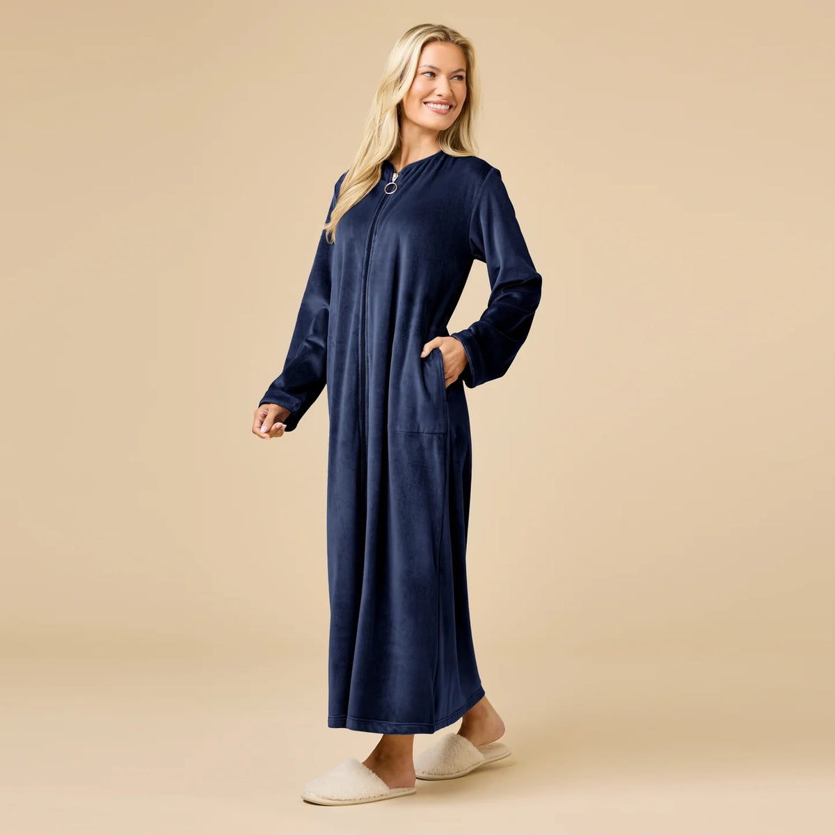 A long-sleeved, beige SOFTIES - SERENITY SHEAR MINK ZIP ROBE featuring a full-length zipper, round neckline, and two side pockets.