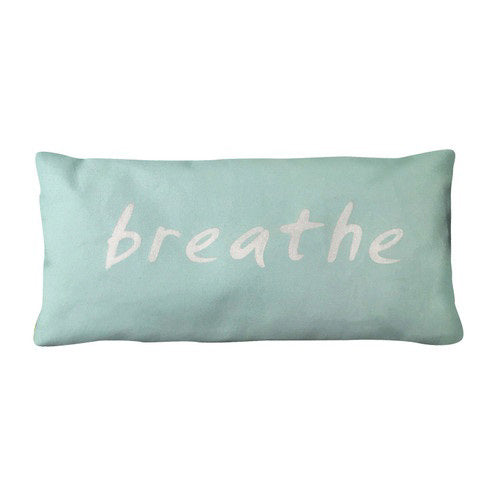 A rectangular light blue eye pillow made from organic cotton, featuring the word &quot;breathe&quot; in white lowercase letters across the front, by BAUDELAIRE.