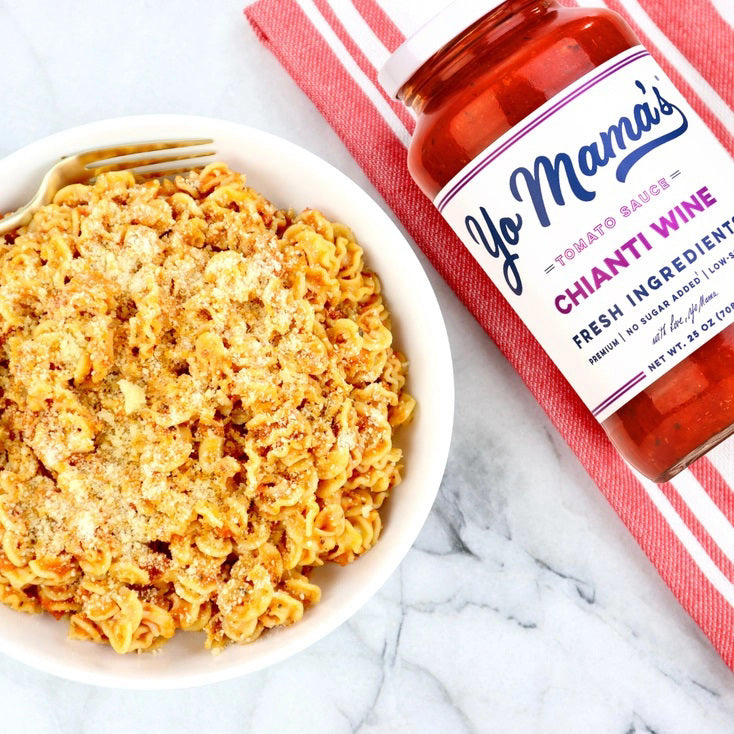 A 25-ounce jar of YO MAMA'S - CHIANTI SAUCE from YO MAMA'S FOODS is displayed. The front label highlights that it is all-natural, contains no added sugar, is low-sodium, and keto certified. The jar brims with a chunky red sauce.