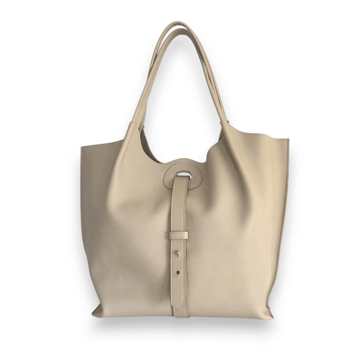 The OLIVEVE Ava shoulder bag in Dakota Cowhide Bone features a smooth finish, oval cutout handle, decorative strap with metal accent, and long shoulder-carry handles. This minimalist beige tote is crafted elegantly and ethically in the USA.